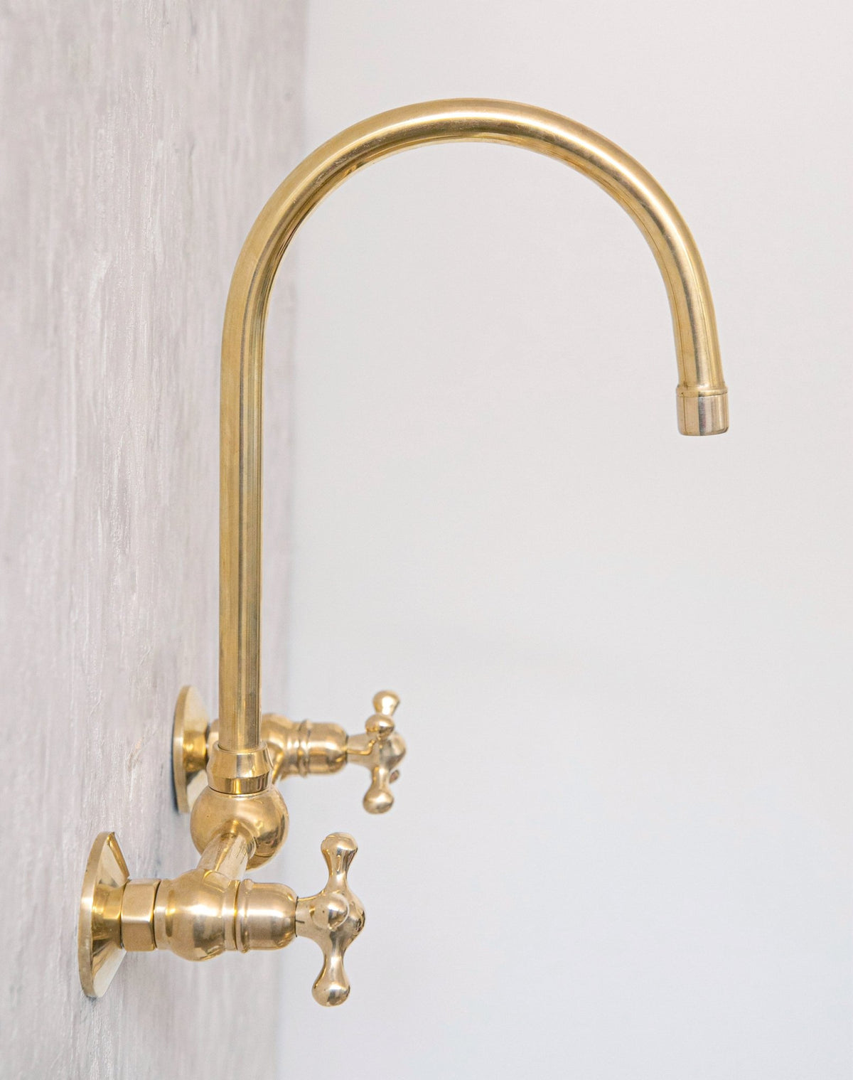 Unlacquered Wall Mounted Brass Gooseneck Faucet for Bathroom and Kitchen - handcrafted luxury Kitchen Faucets for kitchen and bathroom interiors by Brooklyn Brass