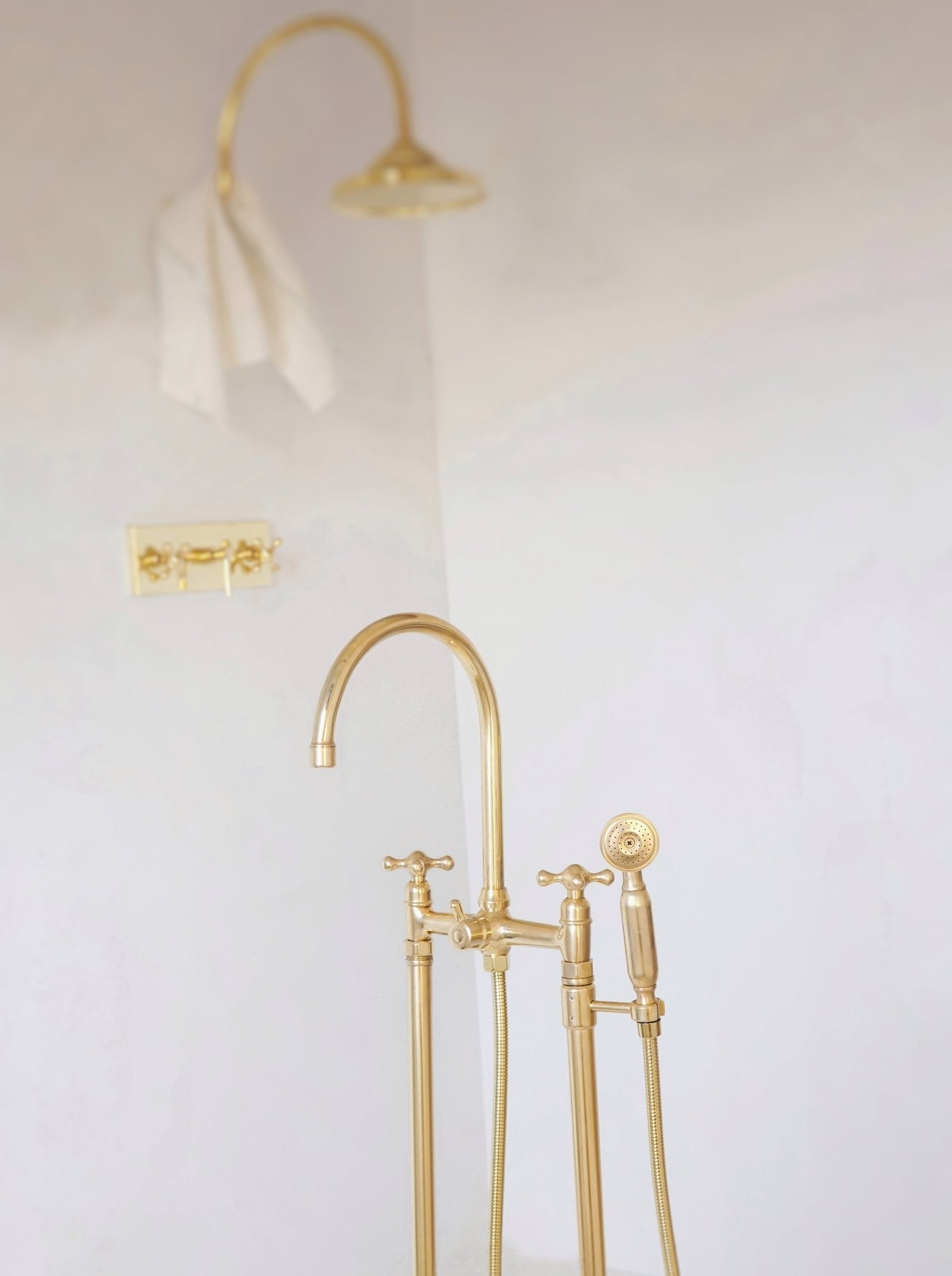 Unlacquered Brass Floor Mounted Bath Tub Filler - handcrafted luxury Showers for kitchen and bathroom interiors by Brooklyn Brass