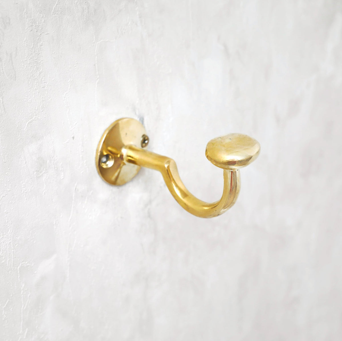 Unlacquered Solid Brass Curved Hook - handcrafted luxury for kitchen and bathroom interiors by Brooklyn Brass